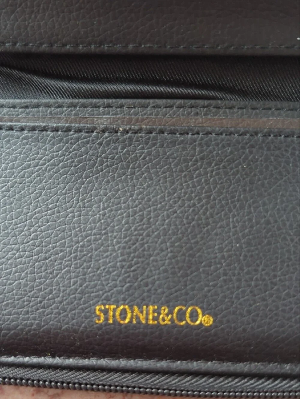 Stone & Co. Black and Brown Leather Wristlet Clutch with Gold Emblem